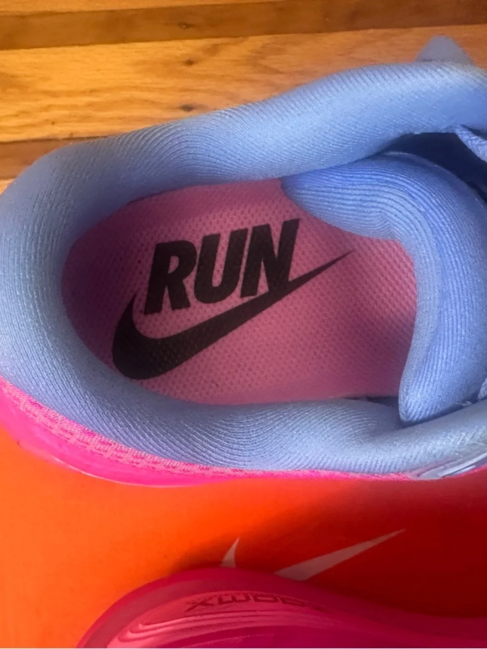 Nike Women's Pink Gradient Sneakers with Light Blue Accents